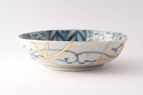 istock Antique broken Japanese plate repaired with gold kintsugi technique 1280370460