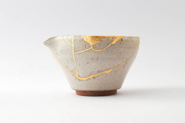 istock Antique broken Japanese beige teapot repaired with gold kintsugi technique 1280370481