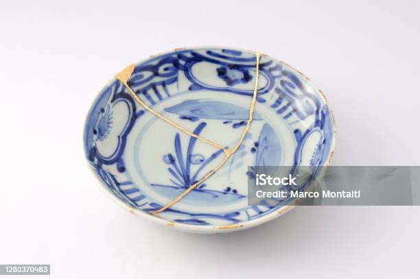 Antique Broken Japanese Plate Repaired With Gold Kintsugi Technique Stock Photo - Download Image Now