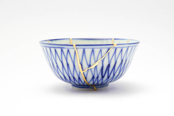 istock Antique broken Japanese bowl repaired with gold kintsugi technique 1280370556