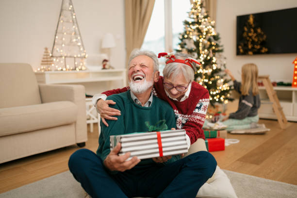 istock Senior couple having fun at home during winter holidays 1280370571