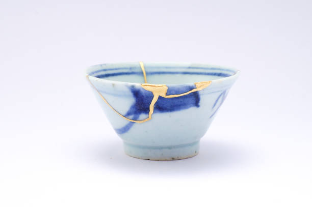 istock Antique broken Japanese sake cup repaired with gold kintsugi technique 1280370612