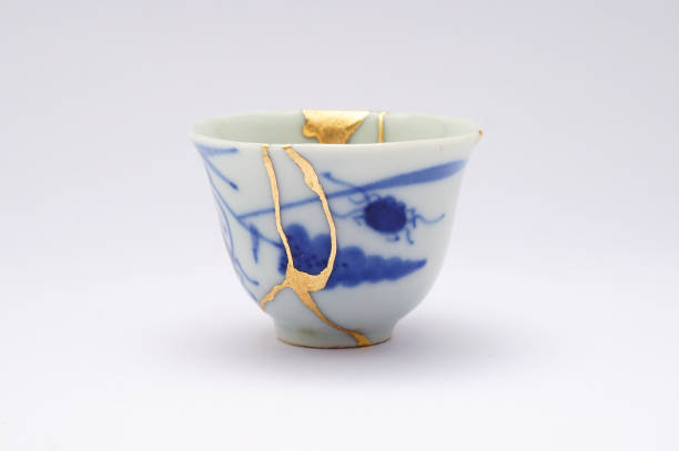 istock Antique broken Japanese sake cup repaired with gold kintsugi technique 1280370642