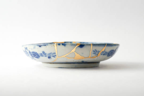 istock Antique broken Japanese plate repaired with gold kintsugi technique 1280370700
