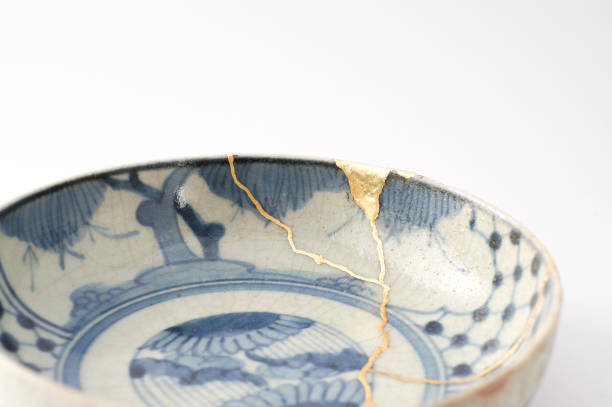 Antique broken Japanese plate repaired with gold kintsugi technique