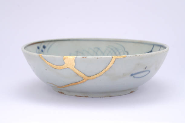istock Antique broken Japanese plate repaired with gold kintsugi technique 1280370714