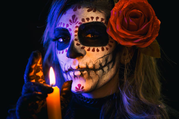 istock Sugar skull creative make up for Halloween ,hand over candle 1280370923