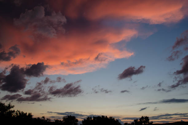 Abstract nature background. Dramatic and moody pink, purple and blue cloudy sunset sky
