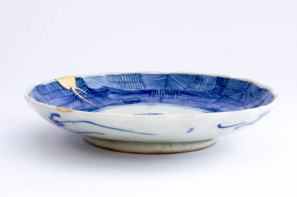 istock Antique broken Japanese plate repaired with gold kintsugi technique 1280373052