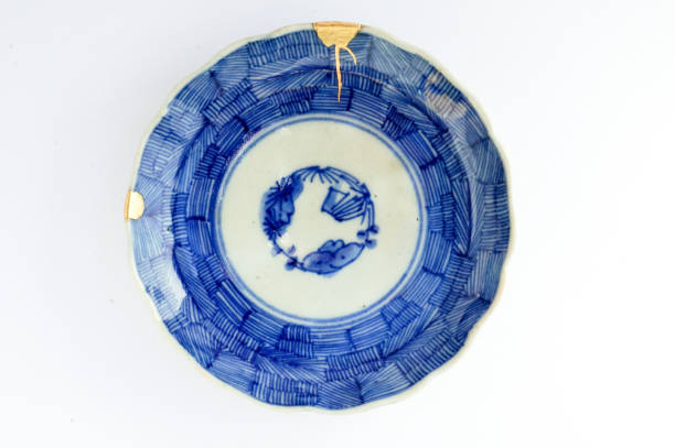 istock Antique broken Japanese plate repaired with gold kintsugi technique 1280373073