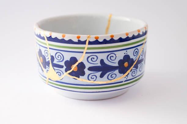 istock Antique broken Italian bowl repaired with gold kintsugi technique 1280373126