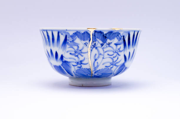 istock Antique broken Japanese bowl repaired with gold kintsugi technique 1280373177