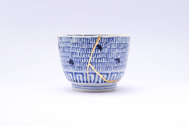 istock Antique broken Japanese bowl repaired with gold kintsugi technique 1280373235