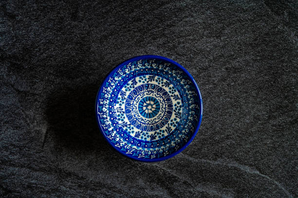 Handmade Ceramic Bowls and Cups Handcrafted with Traditional Ottoman Pattern on Dark Surface and Backround / Handicraft.