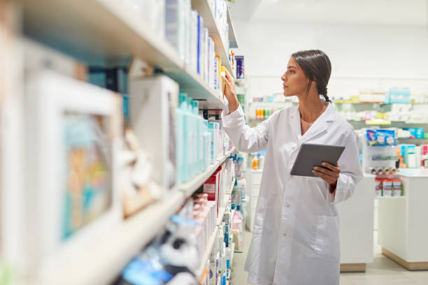 istock One female pharmacist taking inventory on a digital tablet. 1280374568