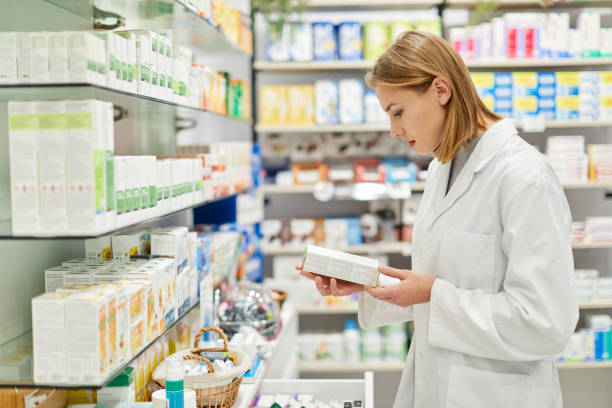 istock One young Russian pharmacist reading an antibiotic label. 1280374592