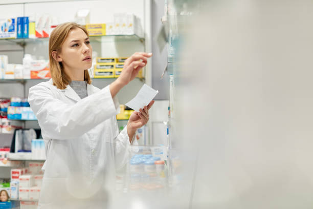 istock One young caucasian pharmacist looking for medicines 1280374596