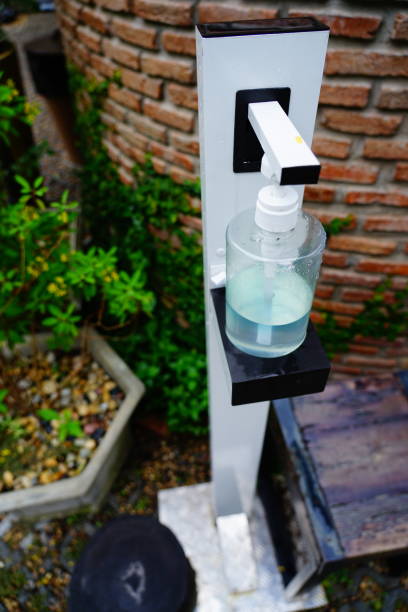 istock Manual with hand sanitizer station 1280374943