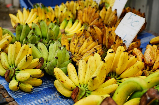 Many banana fruits on market in street food thailand
