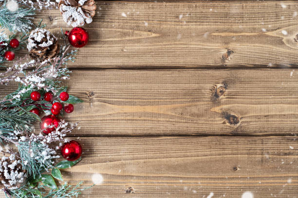 istock Merry Christmas composition. Fir branches with cones, berries and snow decorations on old dark wooden background with copy space for text, flat lay top view 1280377792