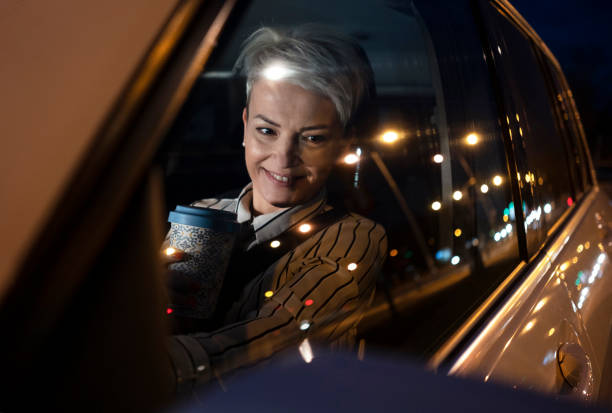 istock Smiling woman in a car 1280378596