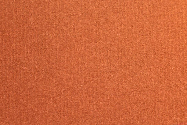 istock Red laid textured paper cardboard background close up 1280379181