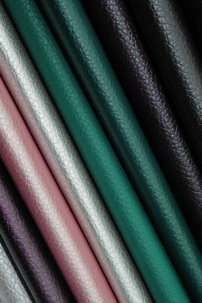 Artificial leather, fabric for upholstery of sofas, armchairs and other furniture. Artificial leather, fabric for upholstery of sofas, armchairs and other furniture. Eco-leather close-up palette of colors. Samples of leatherette of different color background. fake leather stock pictures, royalty-free photos & images