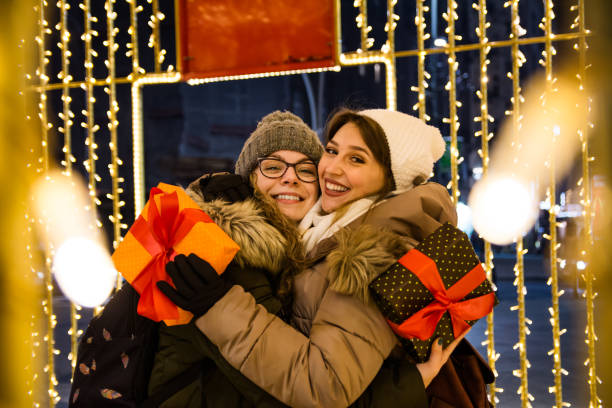 istock Two female friends on a Christmas night 1280380129
