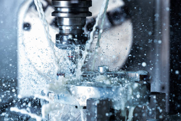 istock a process of vertical cnc steel milling with external water coolant streams and splashes 1280380236