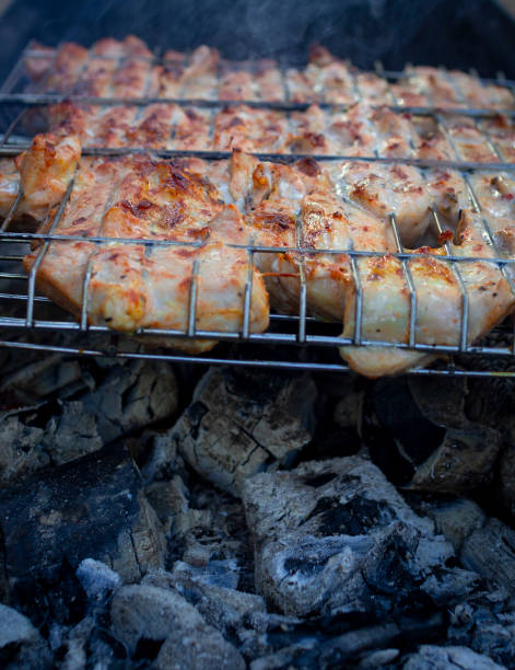 istock Barbecue on the grill. Steaks are cooked over glowing coals. 1280381161