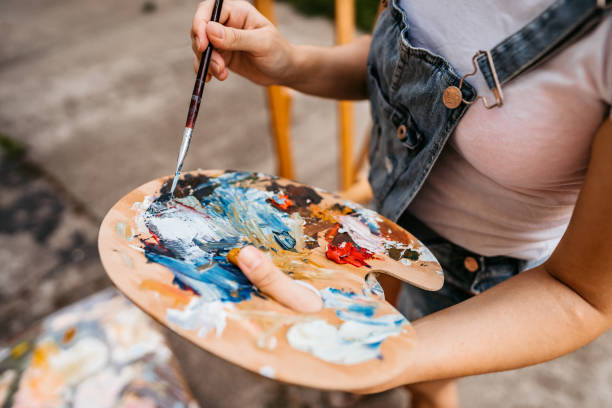 istock Artists palette with mixed colors 1280382885