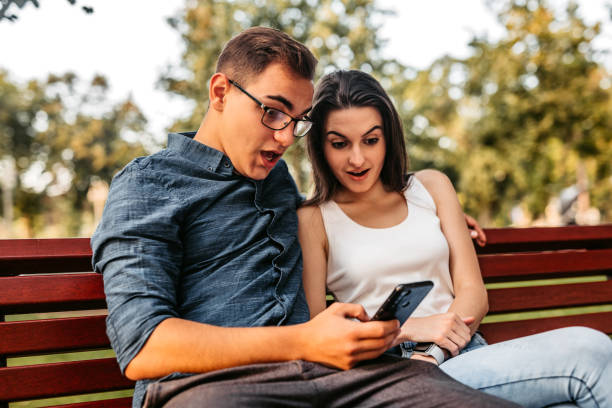 istock Couple checking social media on phone 1280384333