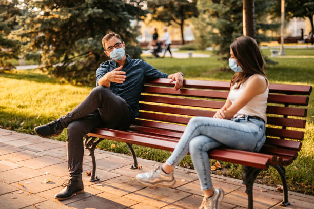 istock Young couple making social distance on date 1280385808