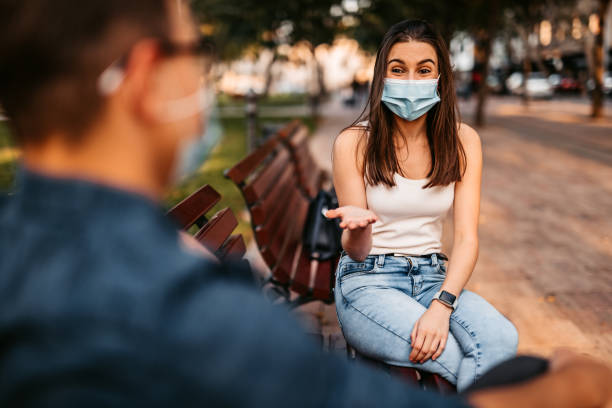 istock Young couple making social distance on date 1280385839