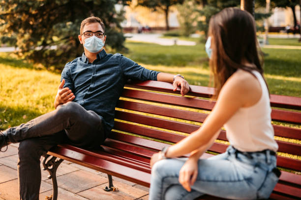 istock Young couple making social distance on date 1280385871