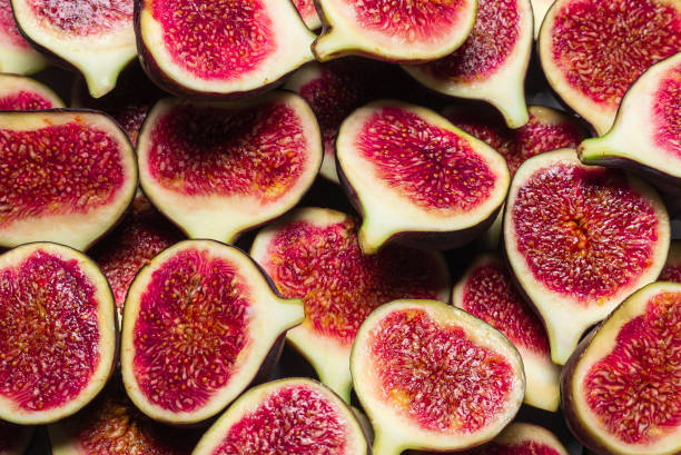 istock Tasty figs background. Top view. 1280386011