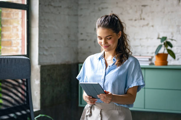 istock Beautiful Businesswoman Using Tablet 1280387551