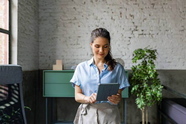 istock Beautiful Businesswoman Using Tablet 1280387554