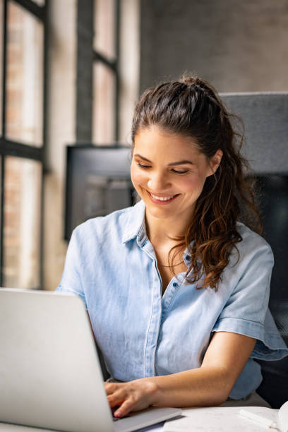 istock Beautiful Businesswoman Enjoying her Work 1280387559