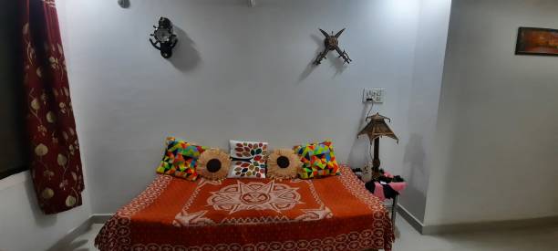 istock Wooden decorated home with colorful bedding 1280388544