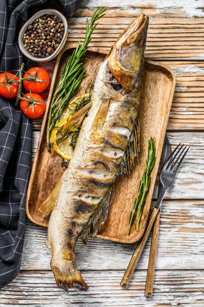 istock Grilled pike perch, pikeperch fish. White wooden background. Top view 1280388613