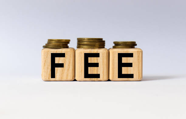 istock cubes with the word FEE on them. Care concept. 1280388813