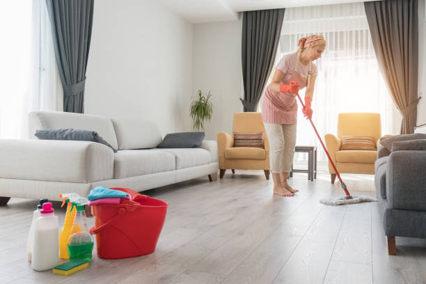 istock Barefoot women doing house cleaning using microfiber wet mop pad . 1280389931