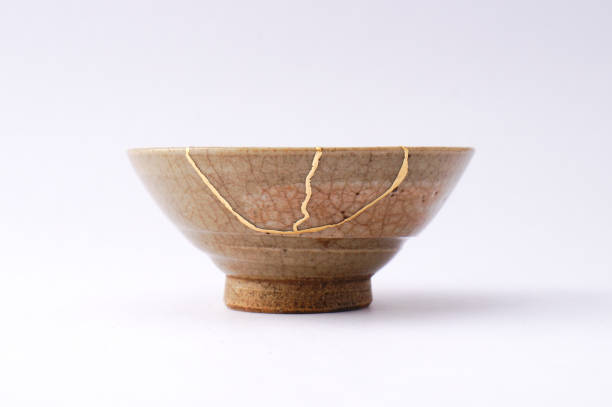 istock Antique broken Japanese tea matcha bowl repaired with gold kintsugi technique 1280390218