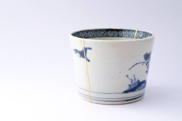 istock Antique broken Japanese blue cup repaired with gold kintsugi technique 1280390220