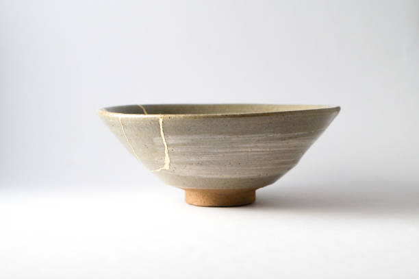 istock Antique broken Japanese tea matcha bowl repaired with gold kintsugi technique 1280390257