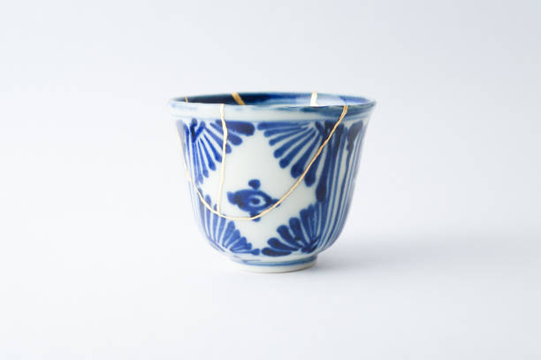 istock Antique broken Japanese blue cup repaired with gold kintsugi technique 1280390292