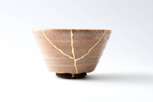 istock Antique broken Japanese cup repaired with gold kintsugi technique 1280390304