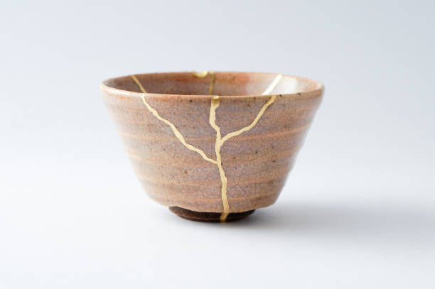 istock Antique broken Japanese cup repaired with gold kintsugi technique 1280390306