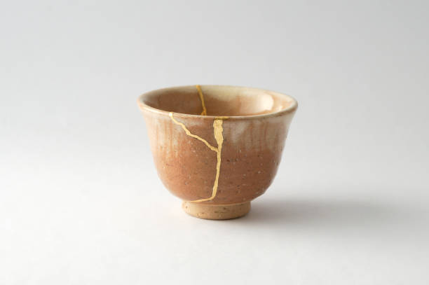 istock Antique broken Japanese cup repaired with gold kintsugi technique 1280390322